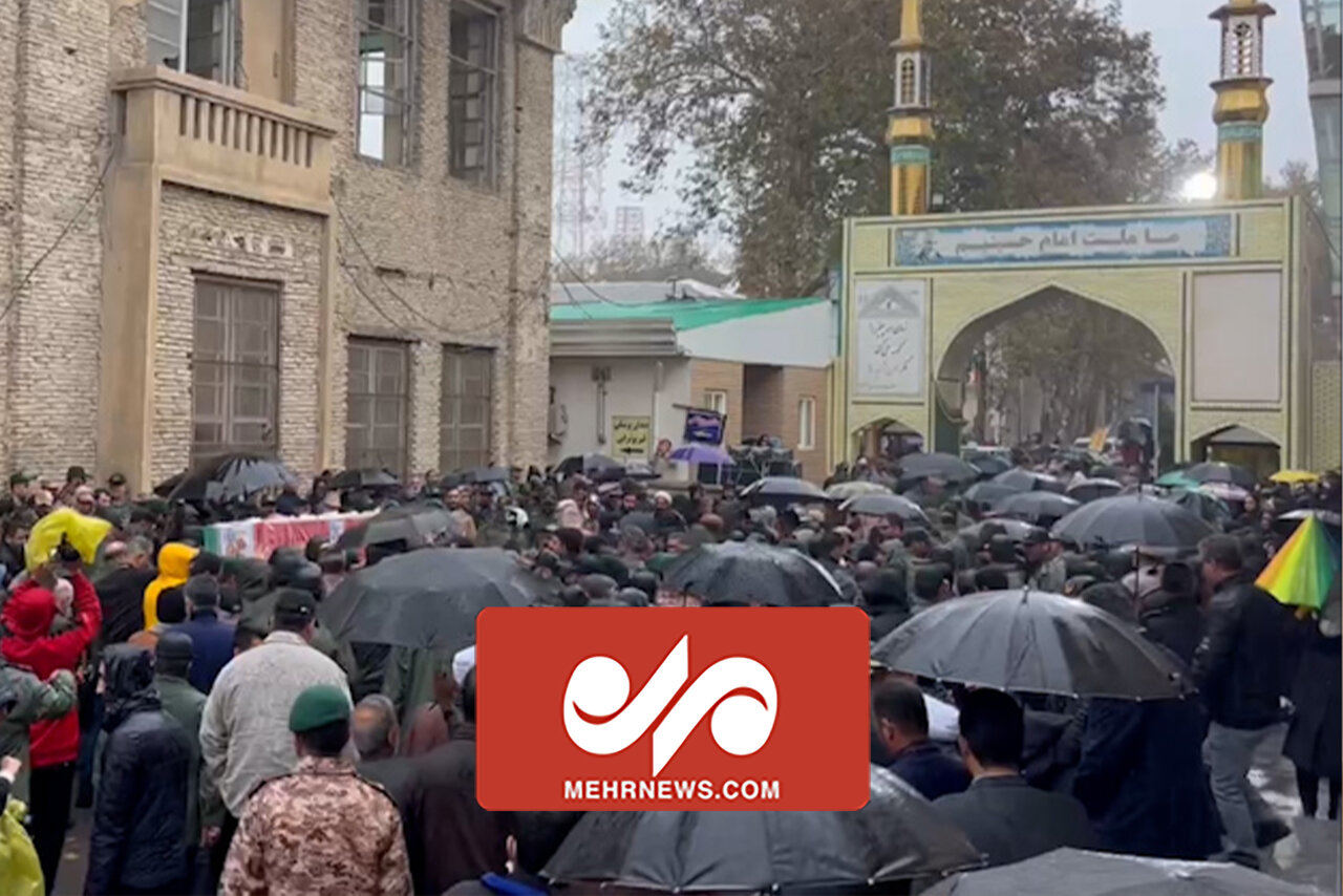 تشییع پیکر شهید گمنام در گیلان زیر باران رحمت الهی